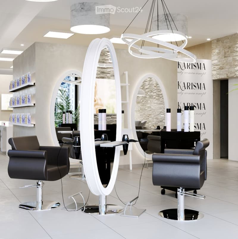 Modern salon with multiple black leather chairs, large round mirrors, white decorative lighting, and shelves displaying products.