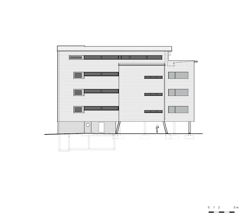 Architectural floor plan of a modern building with multiple windows, a garage entrance, and a raised ground floor.