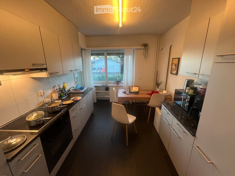 {"type": "Kitchen", "objects": ["stove", "oven", "sink", "faucet", "cabinets", "chair", "table", "laptop", "cup", "pot", "fridge", "coffee maker", "oven mitts", "oven cleaner", "oven cleaner spray", "oven cleaner bottle", "oven cleaner spray bottle", "ove