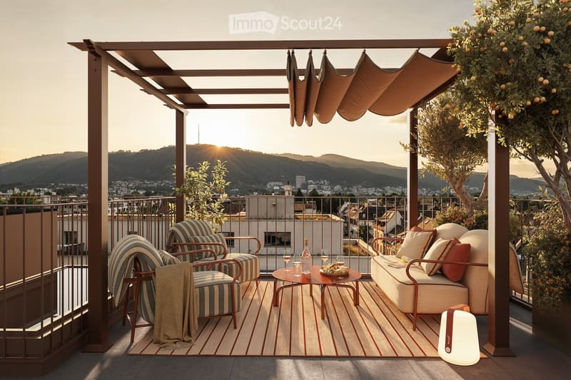 A stylish rooftop terrace with a view of the city and mountains, featuring a sofa, chairs, a coffee table, wine glasses, and a lamp.