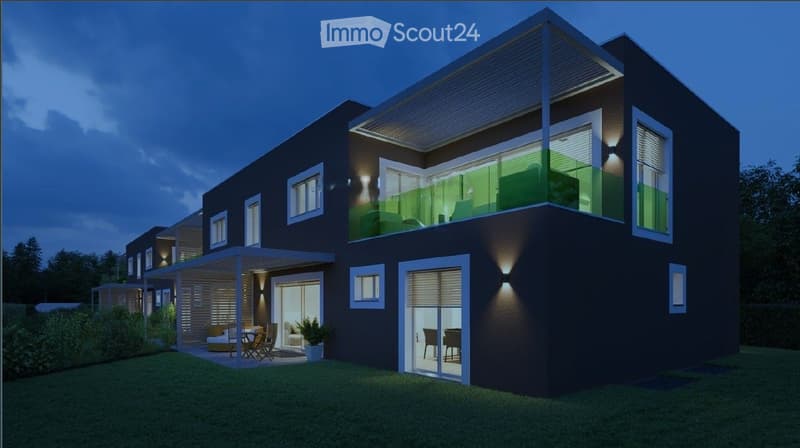 Modern two-story house with dark exterior, large windows, and a balcony on the upper level. The ground floor features a covered patio area with outdoor furniture.