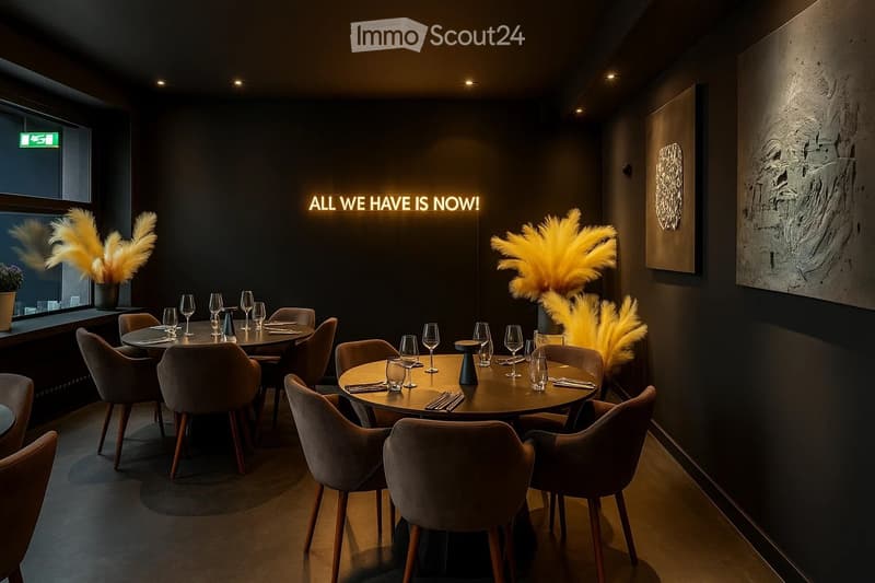 Elegant restaurant interior with round tables, plush chairs, wine glasses, and decorative vases. Dark walls, modern lighting, and artwork.