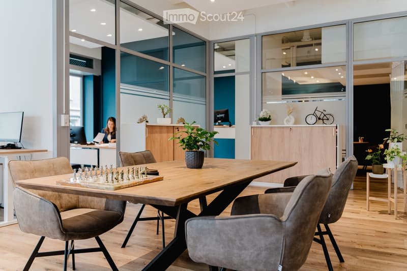 glass walls, chess board, wooden table, wooden floor, office chairs, office desks, plants