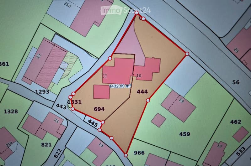 A detailed plot plan showing multiple property lots with labeled boundaries and area measurements in square meters.