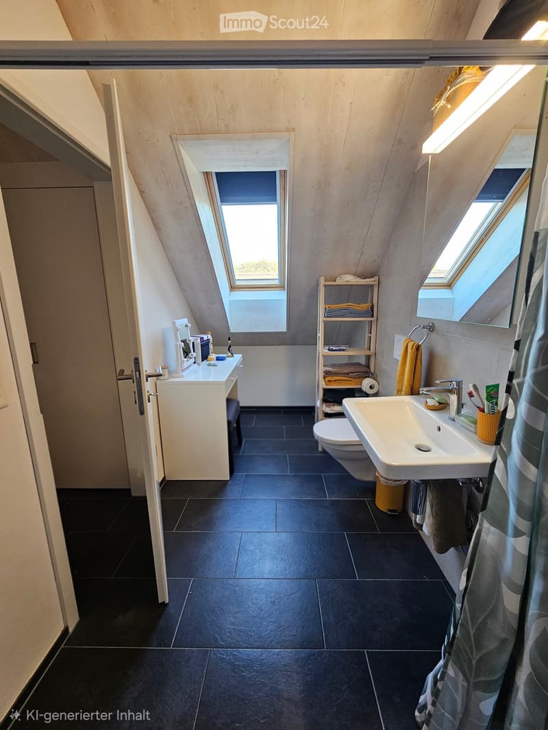 Modern bathroom with dark tiled floor, white sink, toilet, mirror, and a small shelf holding towels and toiletries. Skylight windows provide natural light.