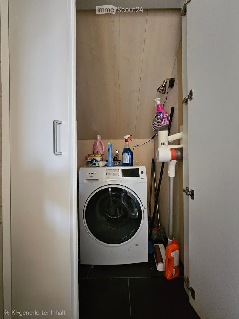 Laundry area with a white Siemens washing machine, cleaning supplies, and a small shelf holding additional items.