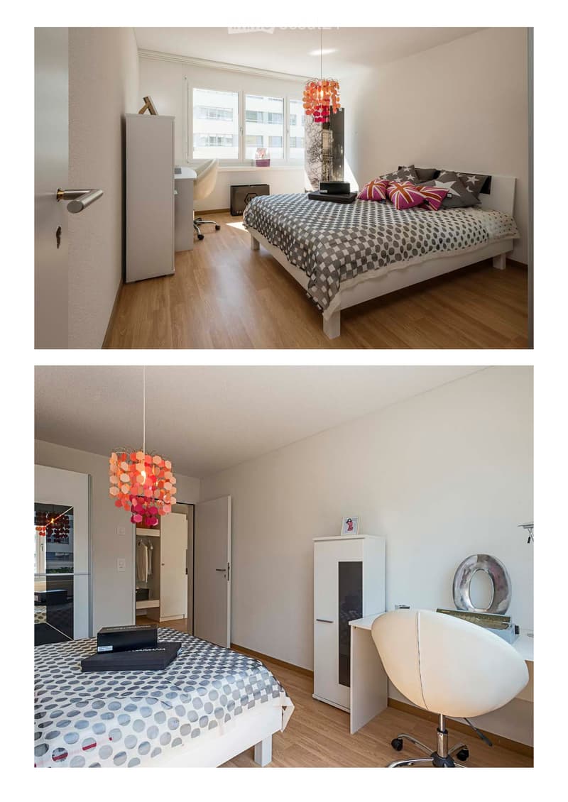 Modern bedroom with a bed, desk, chair, wardrobe, and a colorful hanging lamp. The room features wooden flooring and large windows with a city view.