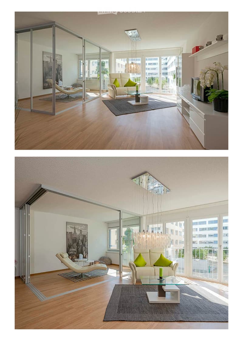 Modern living room with light-colored furniture, a glass coffee table, a sofa with green cushions, a TV stand, and a potted plant. The room features large windows and a sleek, contemporary design.