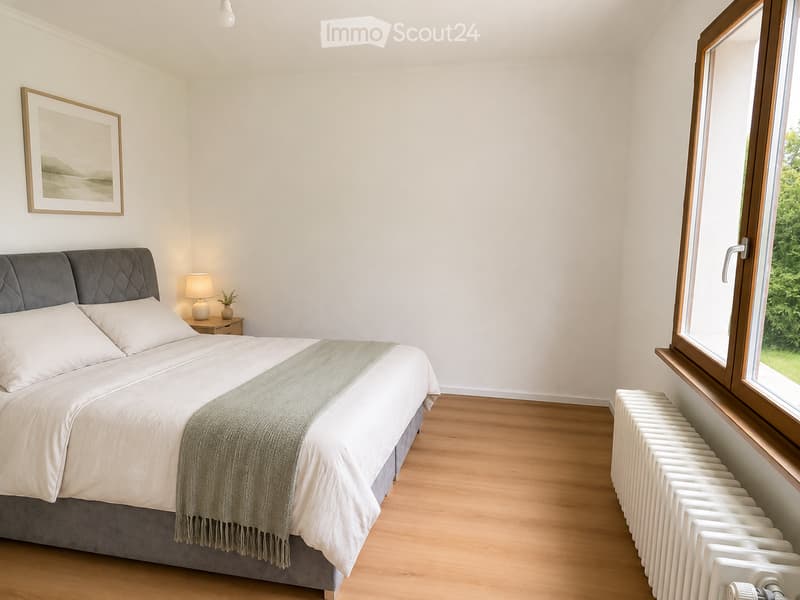 Modern bedroom with a large bed, nightstand, lamp, picture frame, and radiator near the window.
