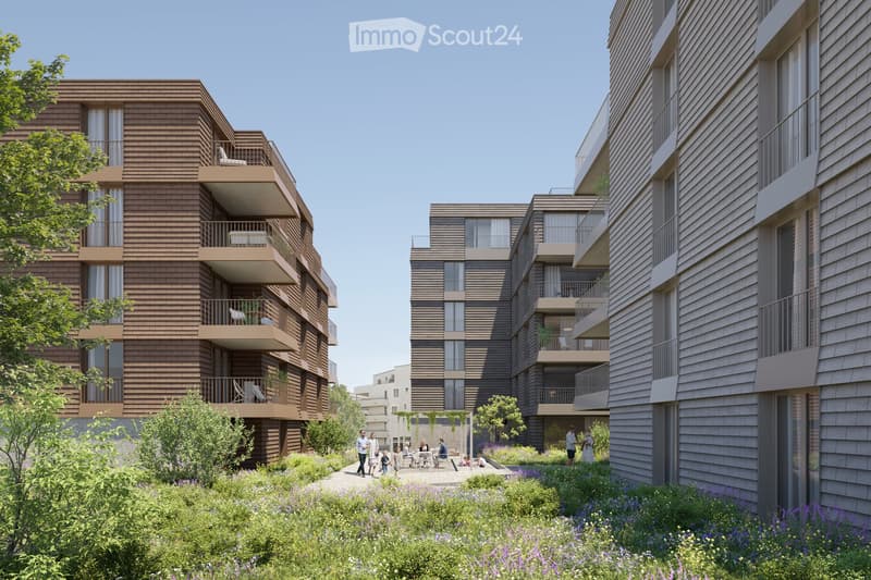 Modern multi-story residential building with wooden facades, balconies, and surrounding greenery.