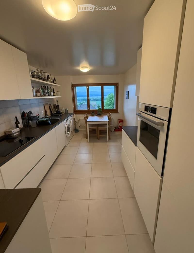 {"type": "Kitchen", "objects": ["cabinets", "sink", "oven", "washing machine", "table", "chairs", "cupboards", "bottle", "cup", "faucet", "bottle", "cup", "cup", "cup", "cup", "cup", "cup", "cup", "cup", "cup", "cup", "cup", "cup", "cup", "cup", "cup", "c