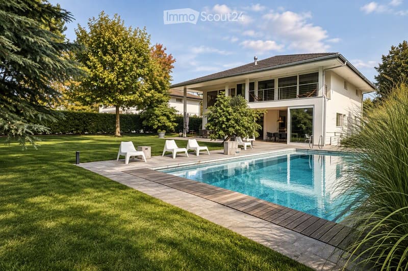 A modern house with a spacious garden, featuring a swimming pool, lounge chairs, and a well-maintained lawn.