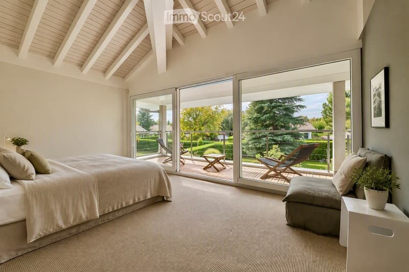 Bright bedroom with large windows and sliding glass doors leading to a balcony, featuring a bed, sofa, nightstand, and potted plants.