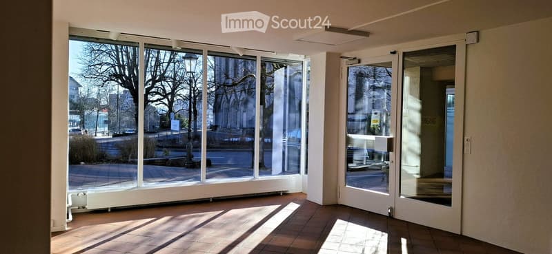 large windows, tiled floor, double entrance doors, modern lamps