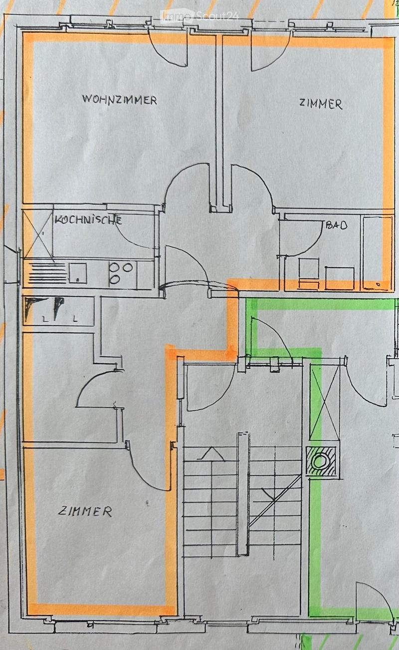 Floor plan showing a living room, kitchen, two bedrooms, and a bathroom. Includes a staircase leading to another level.