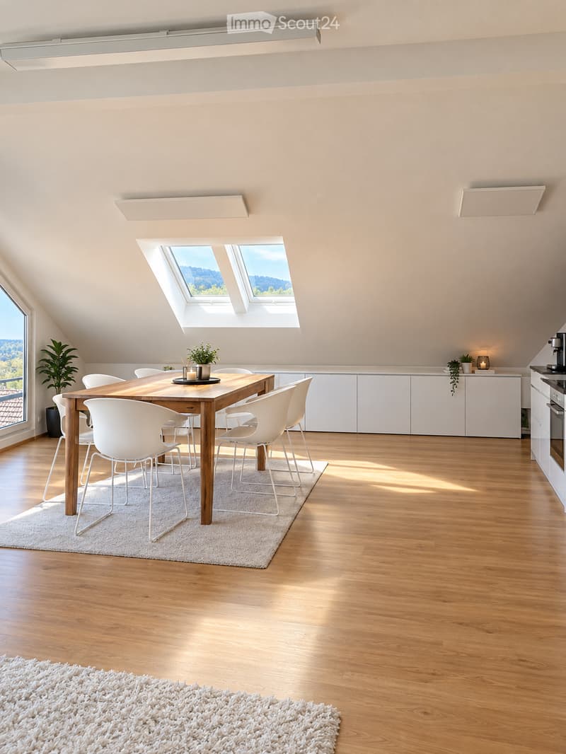 Bright, modern dining area with wooden floor, white dining table and chairs, white cabinets, and a view through large windows and skylights.