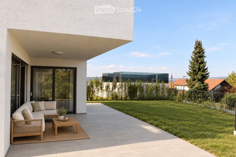 Modern outdoor patio with a white sectional sofa, wooden coffee table, wicker chair, and small potted plant, adjacent to a well-maintained lawn and modern house.