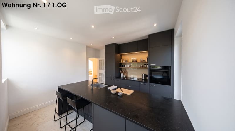 {"type": "Kitchen", "objects": ["kitchen island", "sink", "faucet", "stools", "oven", "cabinets", "cutting board", "bowl", "cup", "bottle", "cupboard", "cupboard", "cupboard", "cupboard", "cupboard", "cupboard", "cupboard", "cupboard", "cupboard", "cupboa