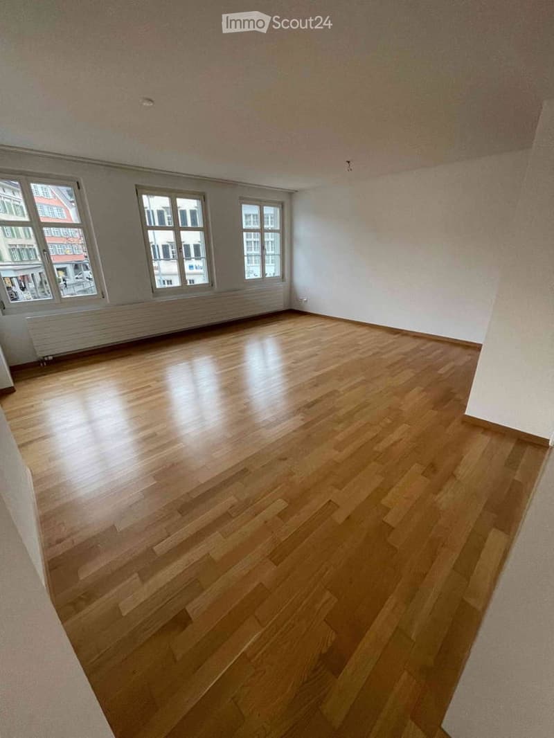 Completely empty room with bare walls and wooden floor. No furniture or equipment.