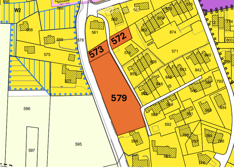 Floor plan showing multiple lots and buildings, with lot numbers 573, 572, 579 highlighted in orange.