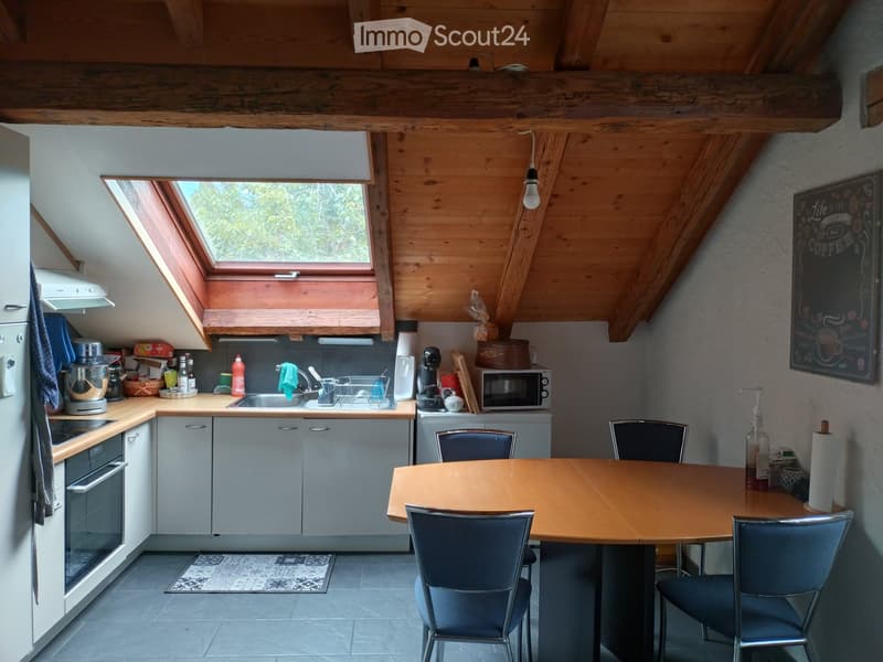{"type": "Kitchen", "objects": ["refrigerator", "oven", "microwave", "sink", "faucet", "dish rack", "table", "chair", "blender", "cupboard", "bottle", "towel", "oven mitt", "cup", "bottle of water", "cupboard", "oven", "oven mitt", "cupboard", "cupboard",