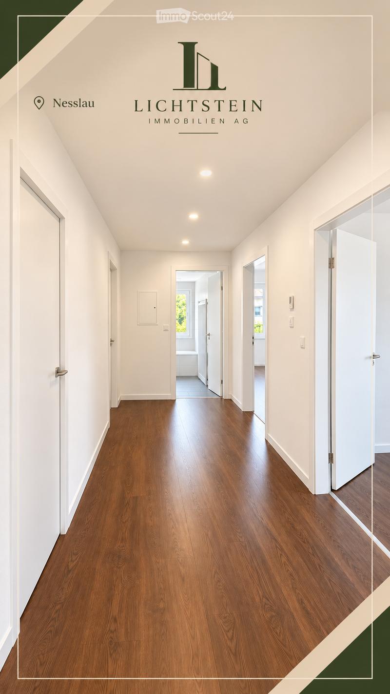 Empty hallway with wooden flooring, white walls, and several doors leading to other rooms.
