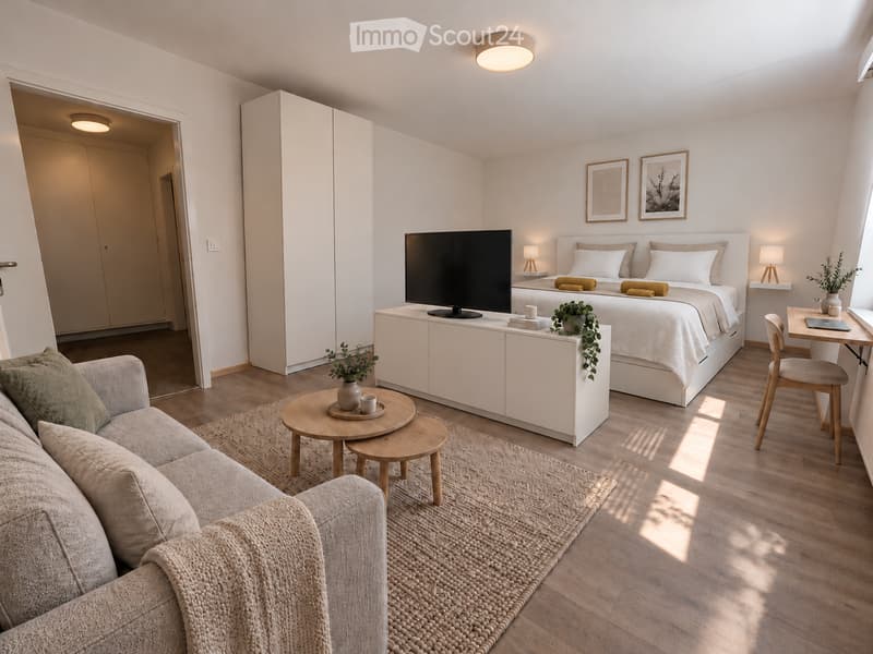 Modern, well-lit bedroom with a sofa, coffee table, bed, nightstand, laptop, chair, and potted plants.