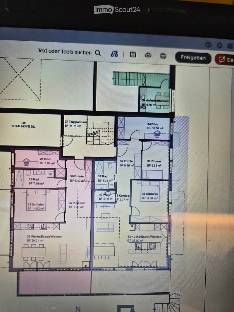 Floor plan of a multi-room building with labeled areas including offices, bedrooms, bathrooms, corridors, and kitchen/dining/living spaces.