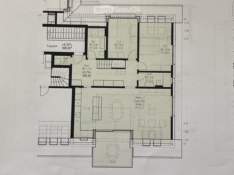 Floor plan showing a multi-room layout including living/dining area, kitchen, bedrooms, bathrooms, and a balcony.