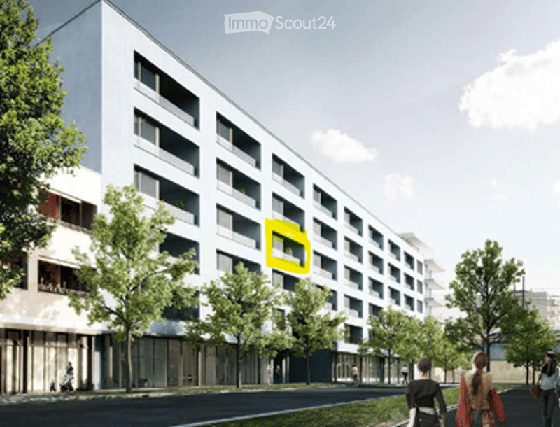 Modern multi-story apartment building with a clean, contemporary design. The facade features large windows and balconies, surrounded by trees and a sidewalk with pedestrians.