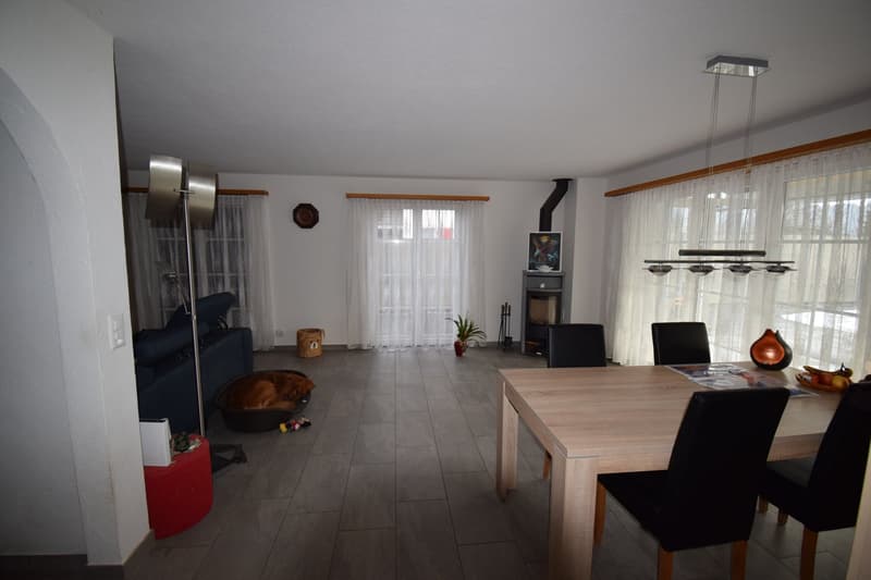 modern room, fireplace, dining table, chairs, light fixtures, couch, basket, rug, potted plant, picture frame