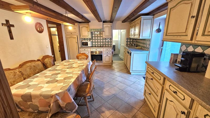dining table, chairs, tile floor, microwave, oven, dishwasher, cabinets