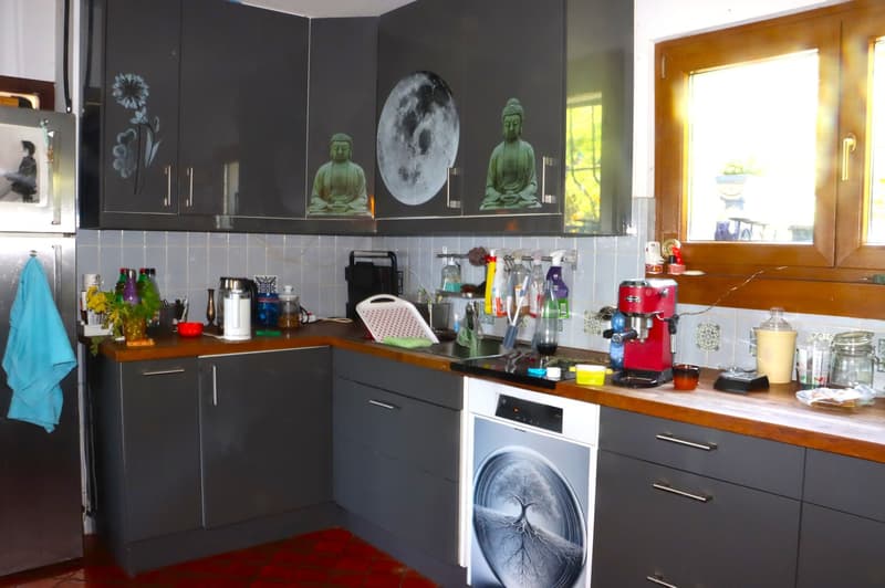 equipped kitchen, cabinets, gas stove, dishwasher, washing machine, refrigerator, countertop, wooden flooring, tiles, window