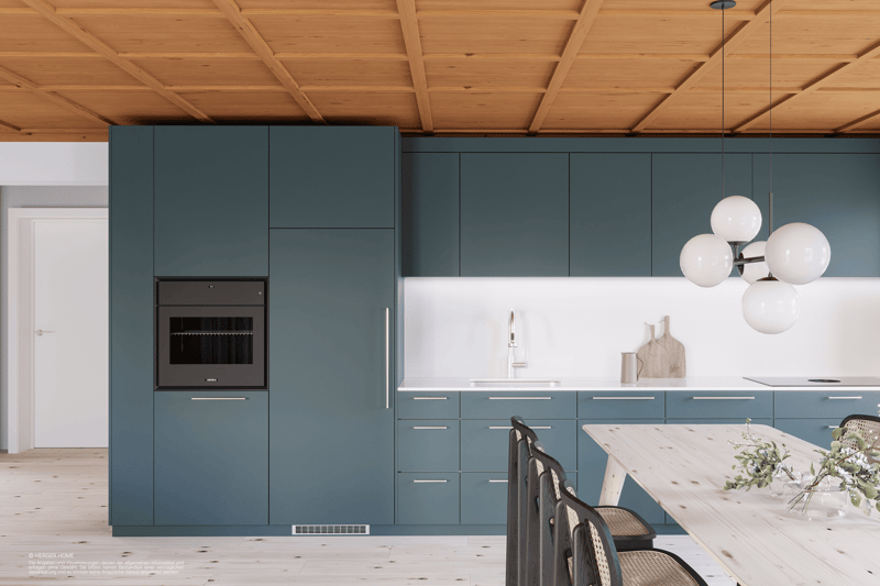 Modern kitchen with dark green cabinets, white countertops, built-in oven, and pendant lighting. The kitchen features a wooden dining table and chairs.