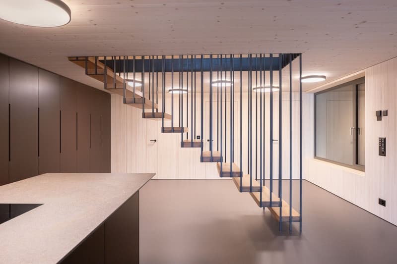 wooden steps, granite countertop, wooden cabinet, lighting fixtures, glass windows