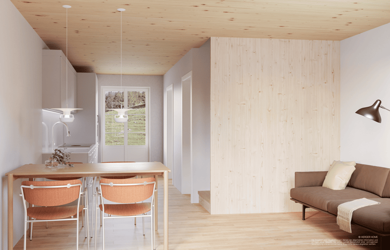 dining room with table and chairs, white ceiling, white walls, wooden floor, kitchen in the background, sofa on the side