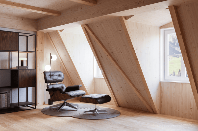 A lounge with a chair, ottoman, wooden shelves, and large windows in the attic.