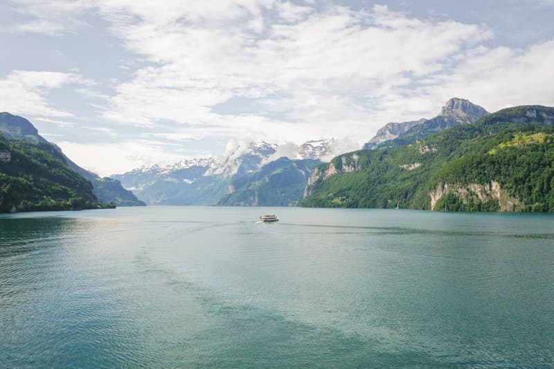 large lake, mountains, boat, clear sky, green trees