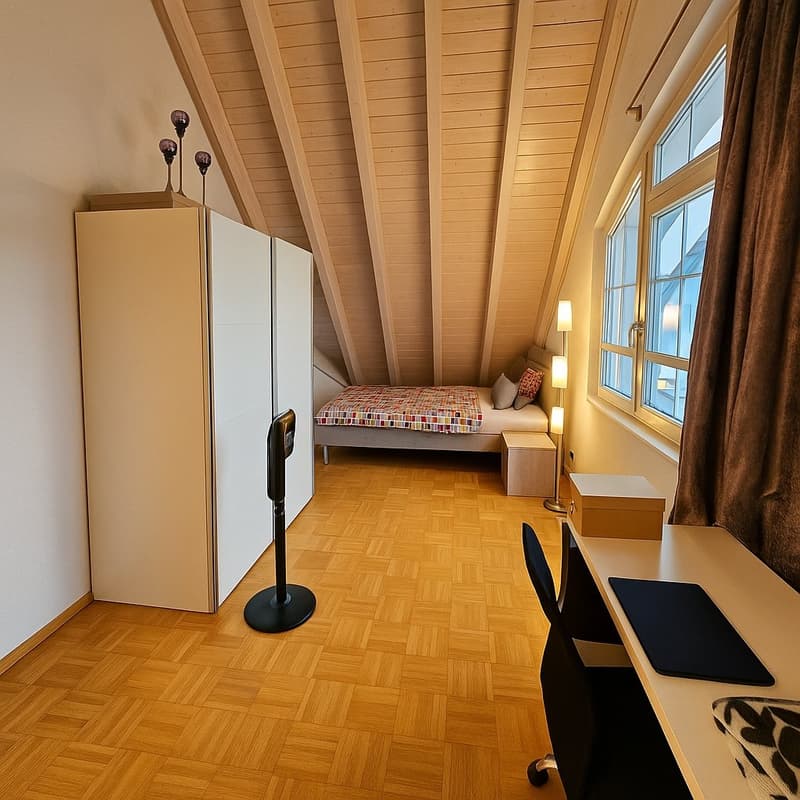 Bedroom with wooden floor, bed, bedside tables, wardrobe, chair, desk, and windows.