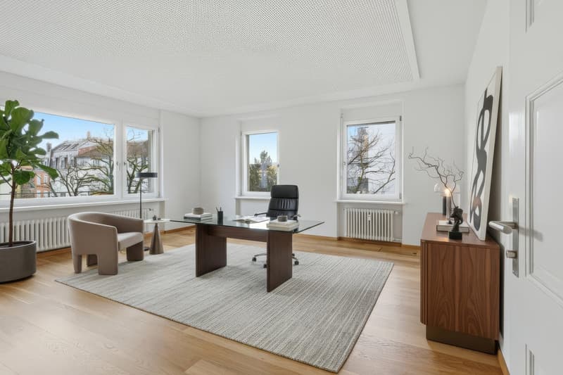 modern office room with wooden floor, white walls, large windows, desk, chair, radiator, rug, potted plant, side table, lamp