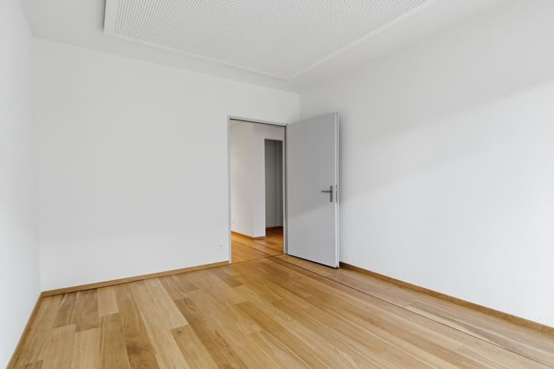 empty room, white walls, wooden floor, open door