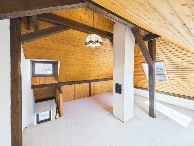 attic room, wooden beams, carpeted floor, windows, lamp