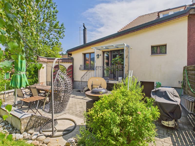 House with a terrace, outdoor dining area, barbecue, and a covered patio.
