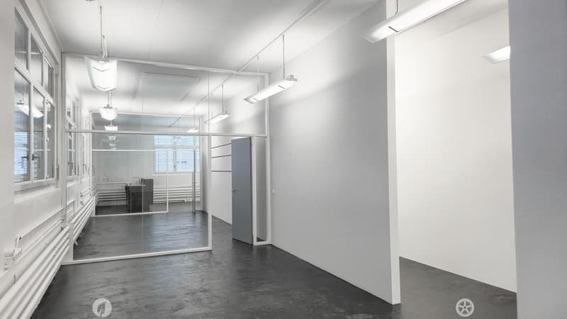 empty room with large windows and a glass wall