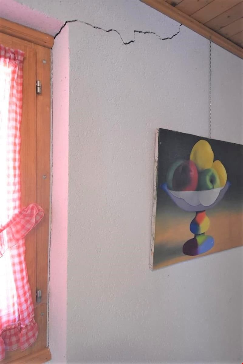 white wall, wooden window frame, red and white checkered curtain, painting of fruit bowl