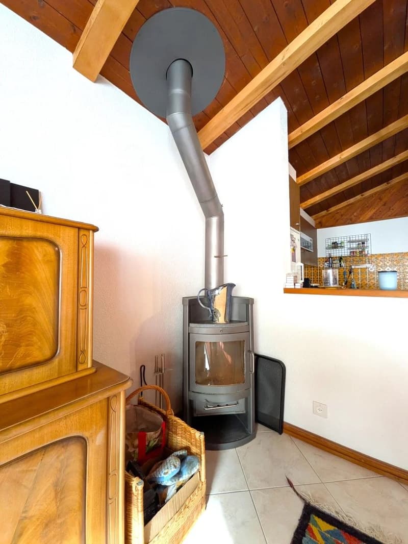 wooden ceiling, fireplace, wooden cabinet, basket, tiled floor