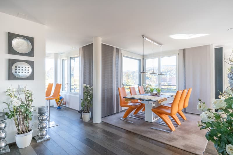 large windows, table and chairs, carpet, modern decorations