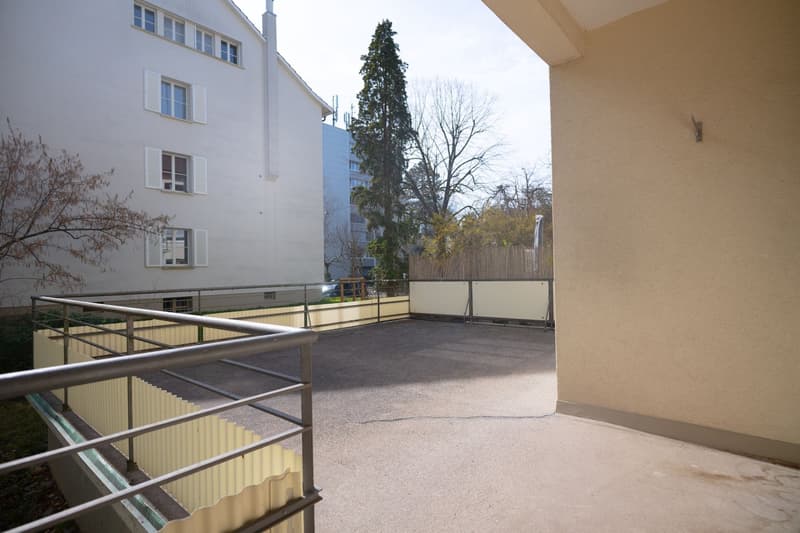 concrete floor, metal railing, no trees visible