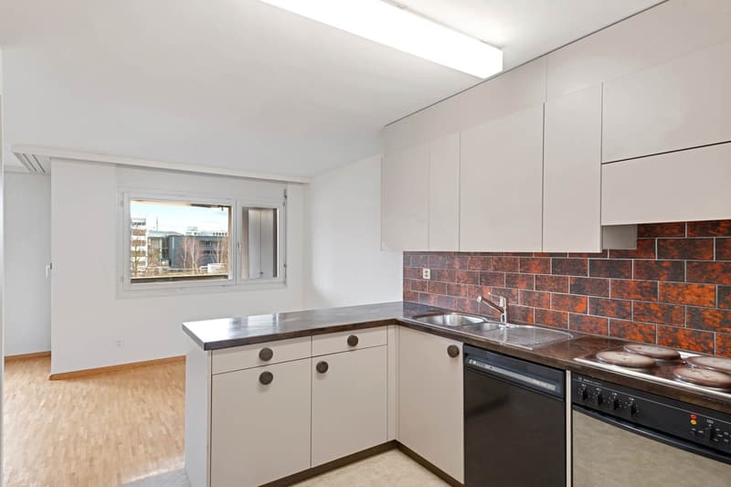 white cabinets, wooden floor, sink with faucet, dishwasher, built-in oven, tiled wall
