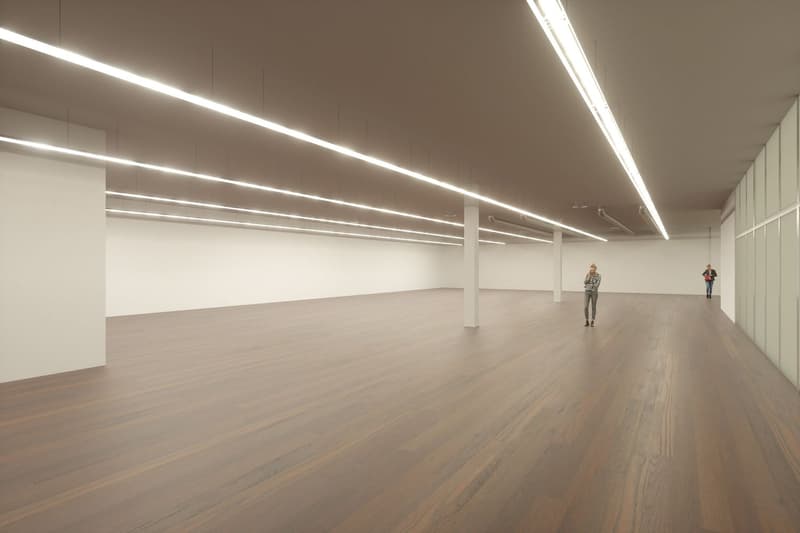 empty room, hardwood floor, long fluorescent ceiling lights, tall white walls, white interior, 2 people